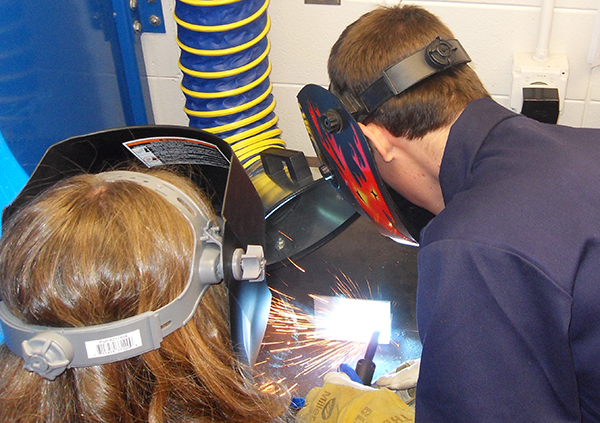 students welding