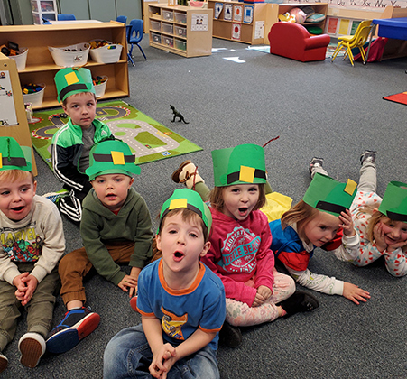 preschoolers in leprechaun hats