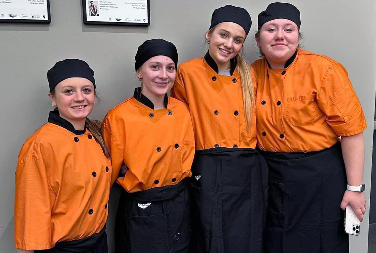 4 students in chef uniforms