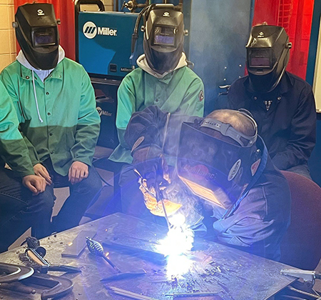 students watching welding demo