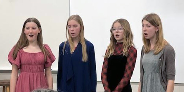 4 students singing