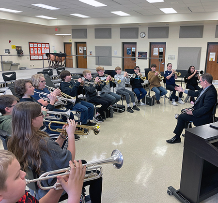artist-in-resident with trumpet players