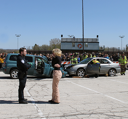 students looking at crash simulation