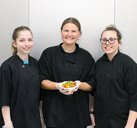 3 students with dish