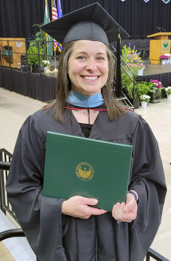 graduate with diploma