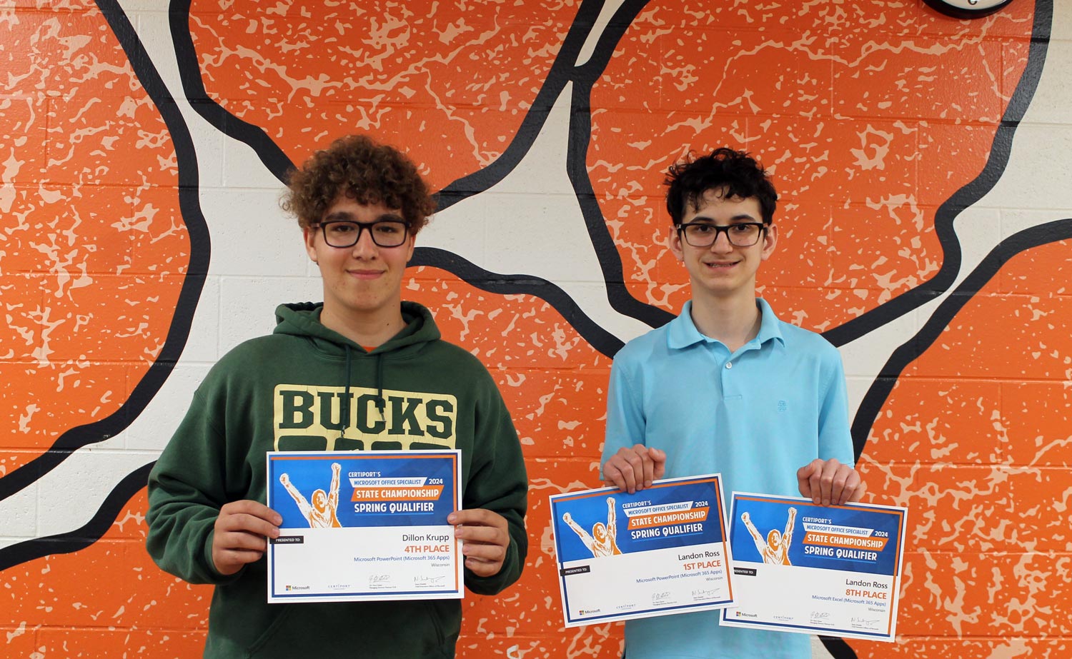 2 students with certificates