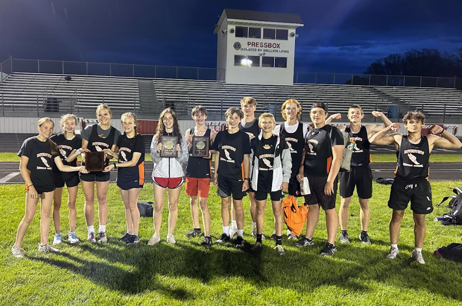 Students with plaques