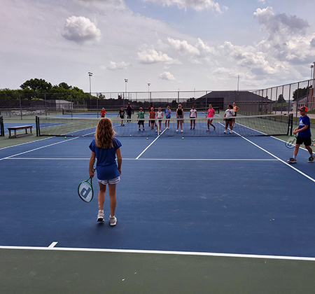 student-athletes on tennis court