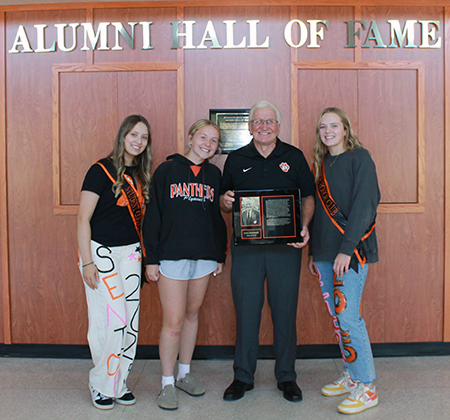 inductee with students