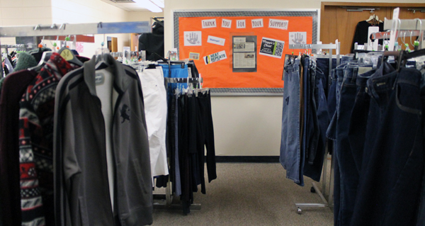 thank-you sign surrounded by clothes racks