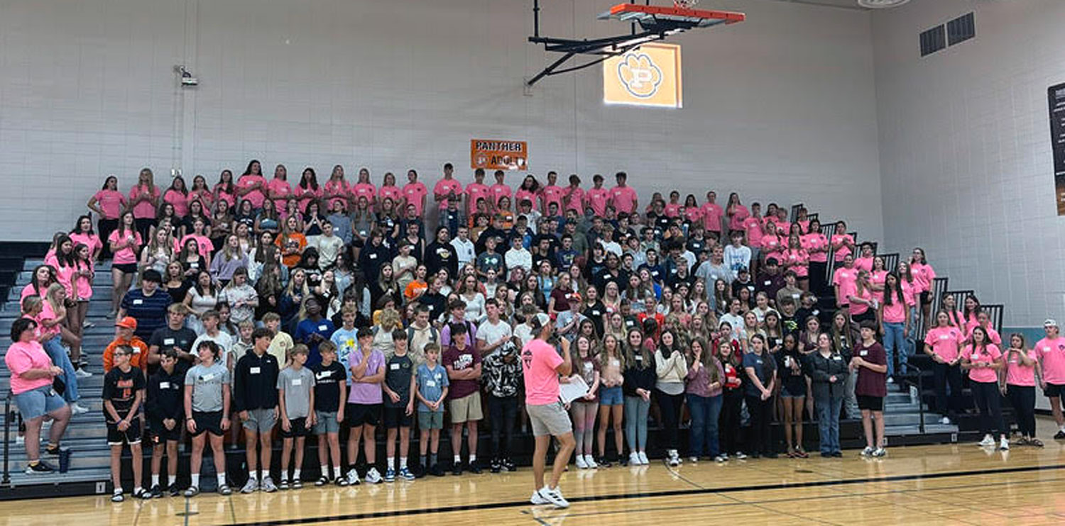 freshmen and Team Panther in gym bleachers