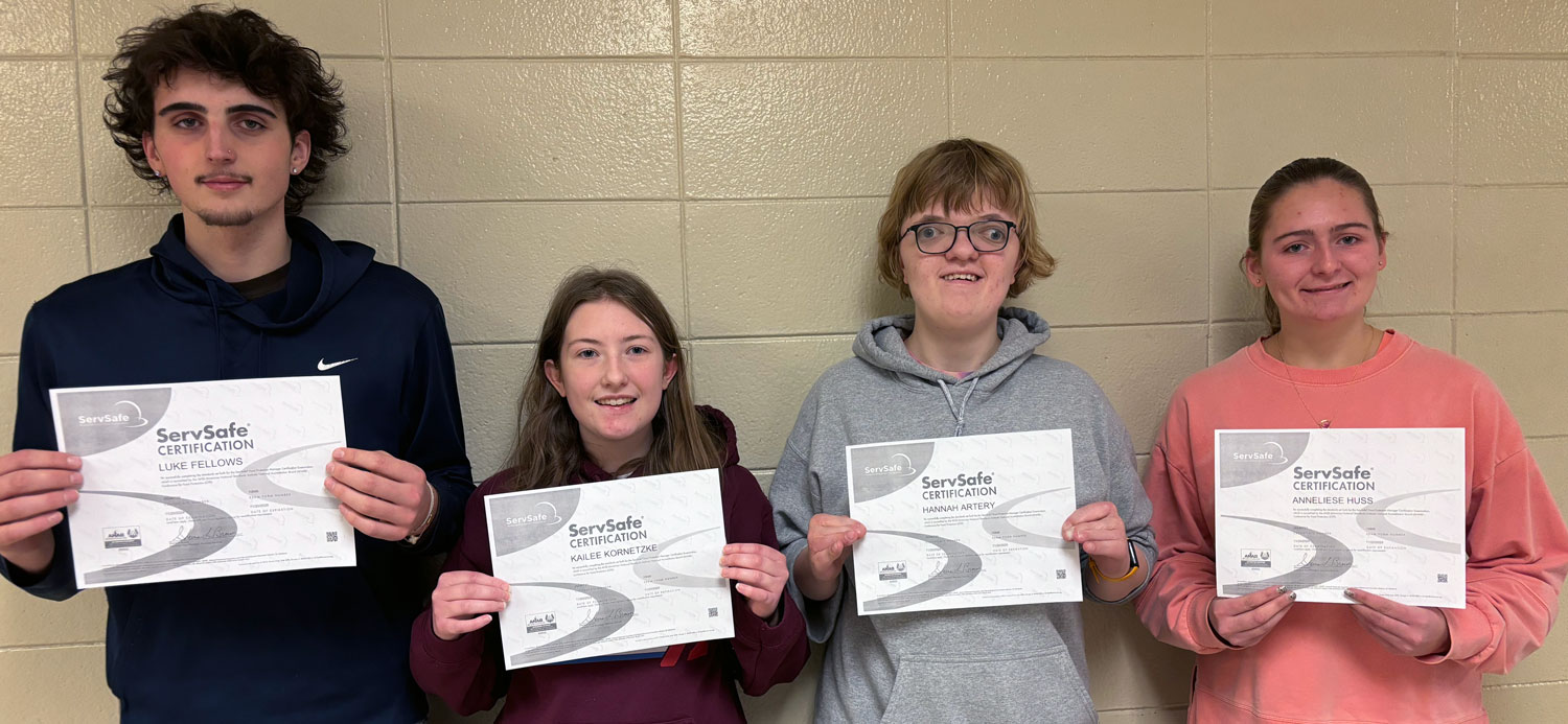 4 students holding certificates