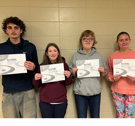 4 students holding certificates