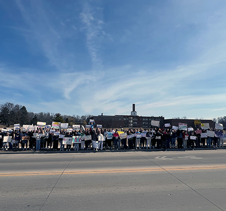 Riverview students holding signs of encouragement