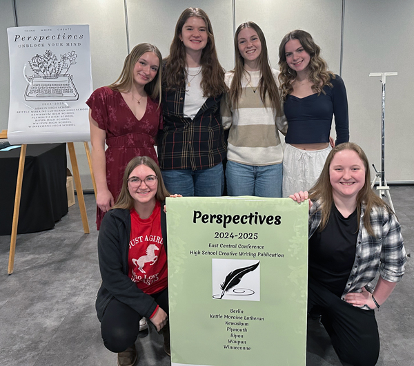 6 students with signs