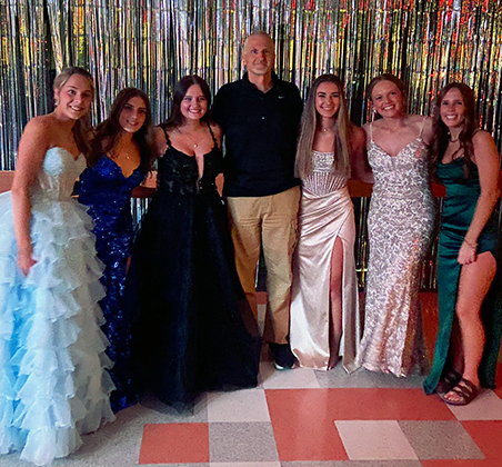 6 girls with softball coach