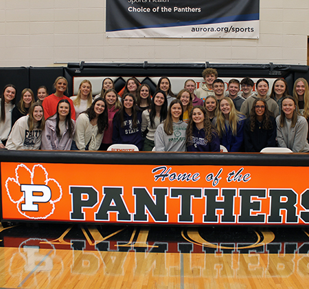 athletes surrounded by friends