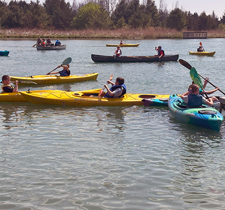 students in kayaks