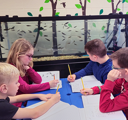 students looking at large aquarium