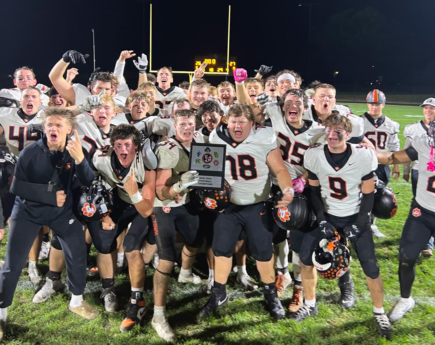 team with conference plaque