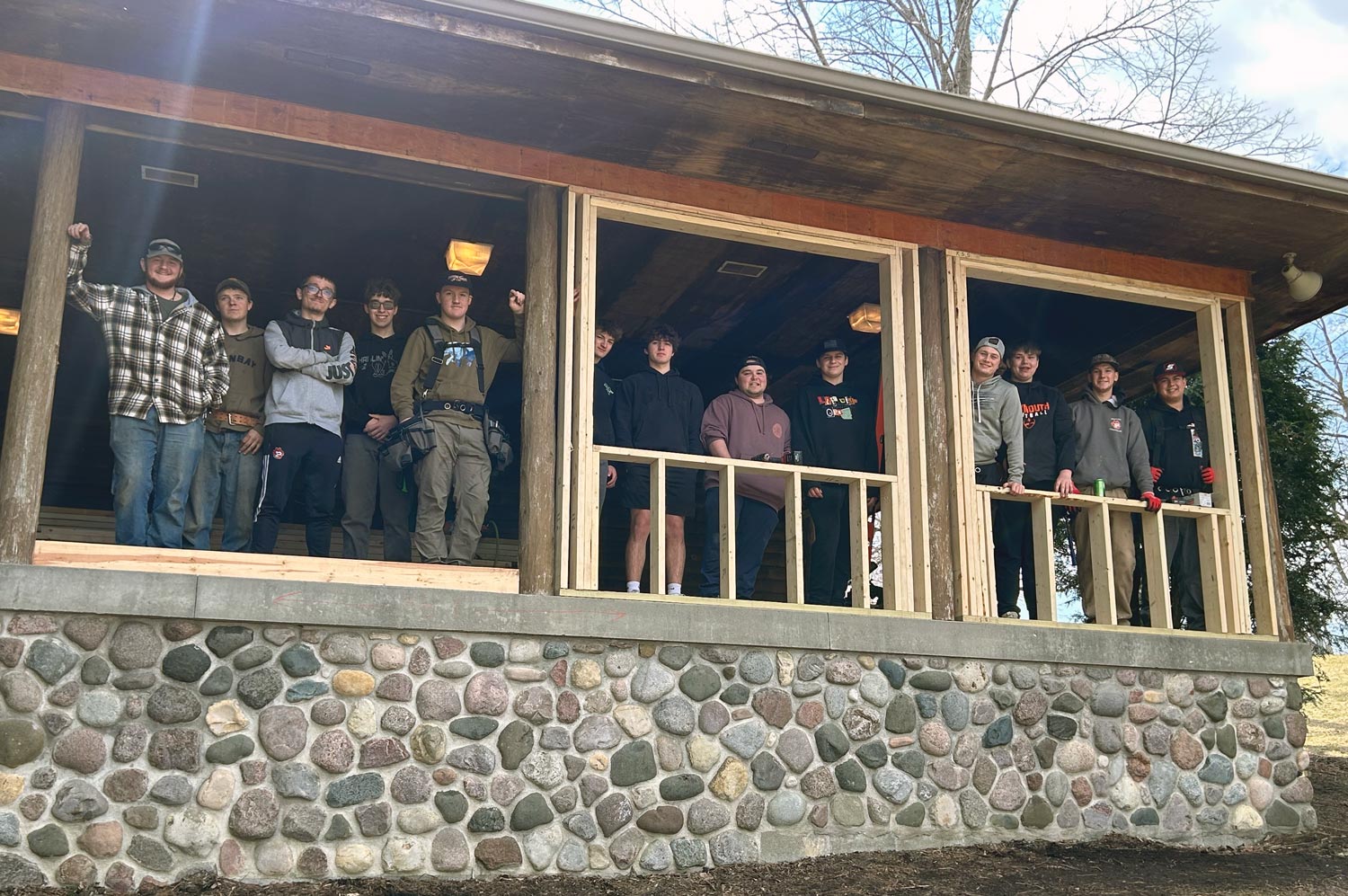 Students looking out shelter windows