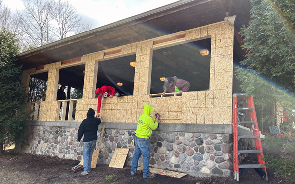 Students constructing exterior wall