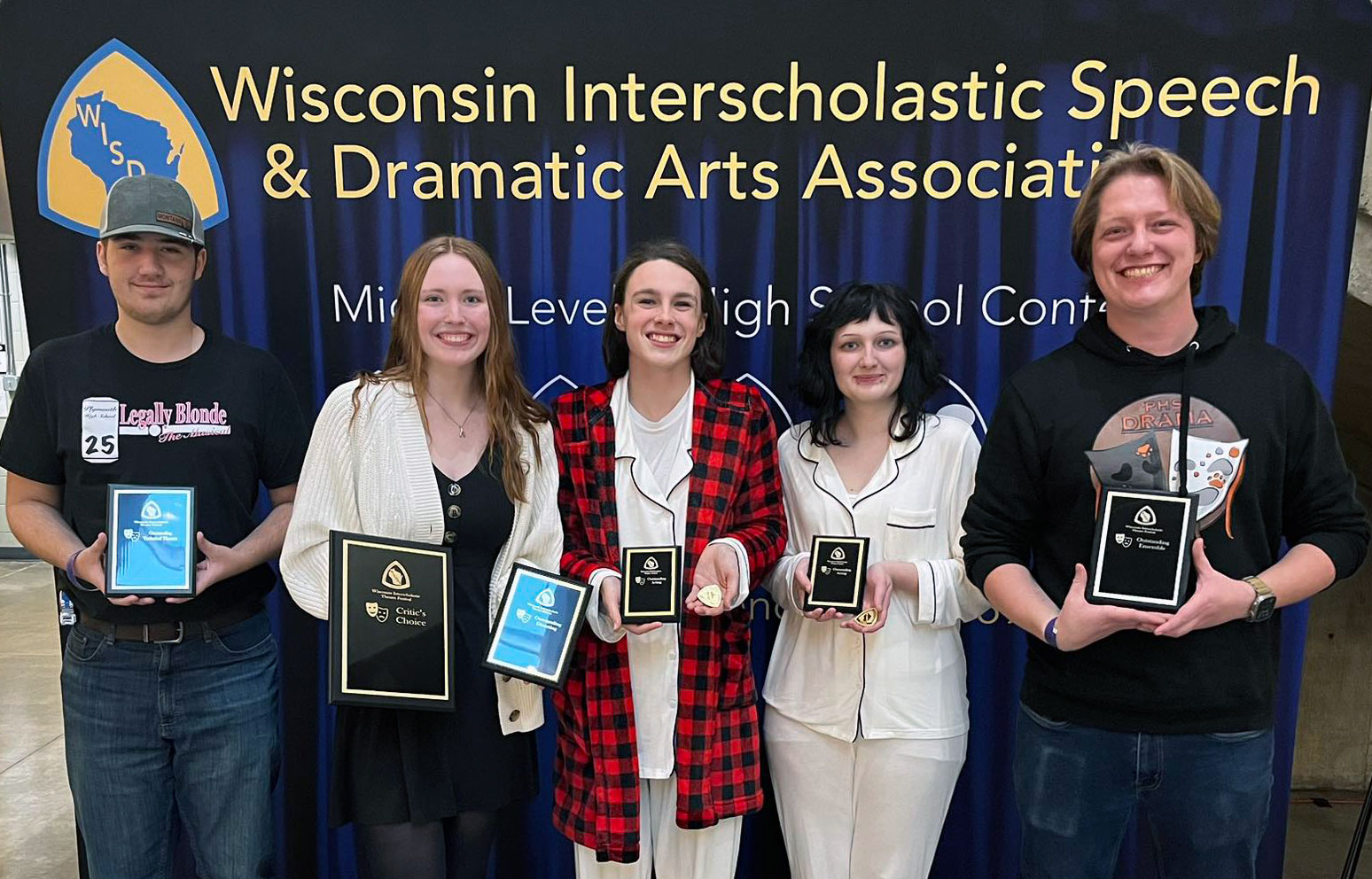 5 people holding plaques
