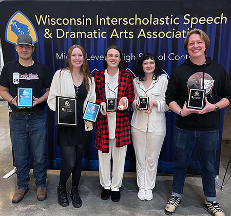 5 people holding plaques