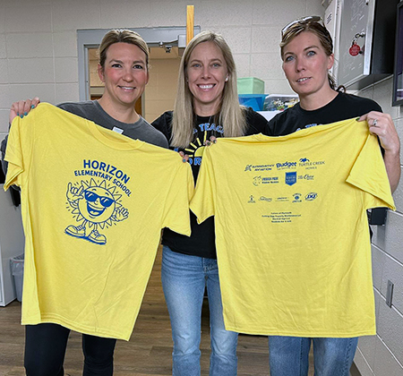 3 people with yellow school T-shirts