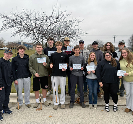 students and instructor with handmade fishing rods