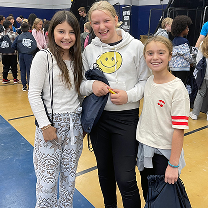 3 students smiling at STEAMfest