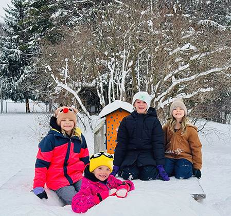 students playing in snow