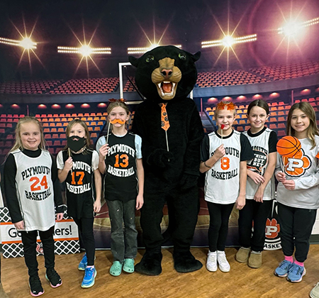 PHS Panther mascot with 6 young athletes basketball jerseys
