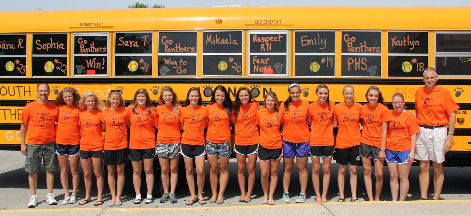 team in front of school bus