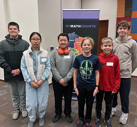 6 students in front of MathCounts banner