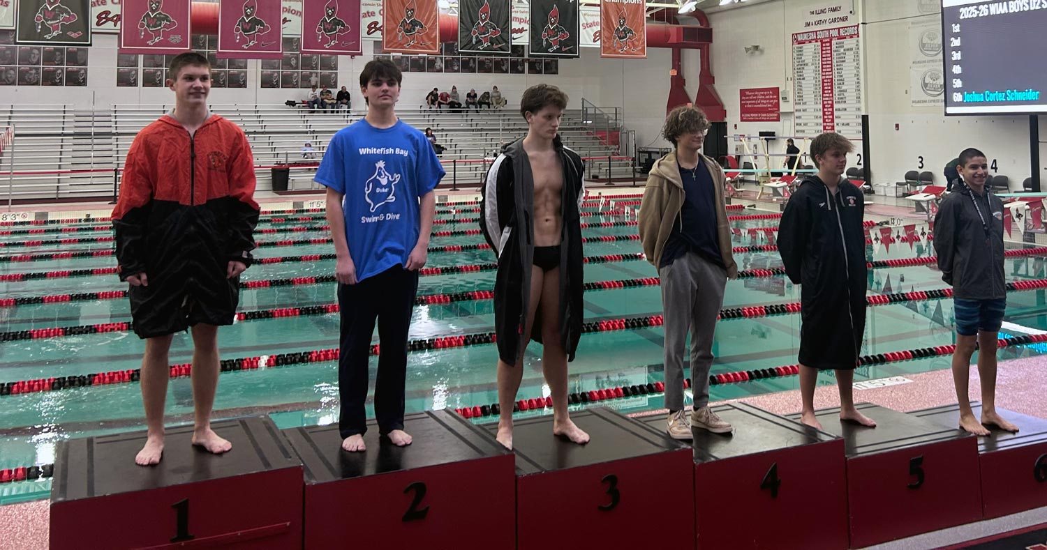 6 divers on podium with pool in background