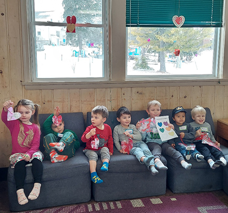 Friday Playgroup participants with heart suncatchers