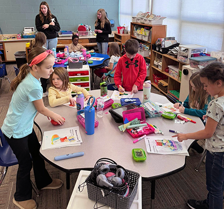 students working at tables