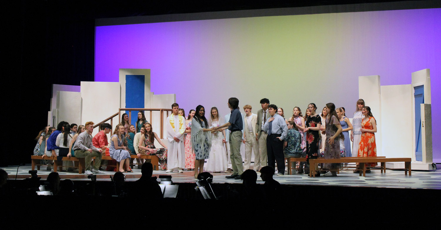 students on stage during dress rehearsal