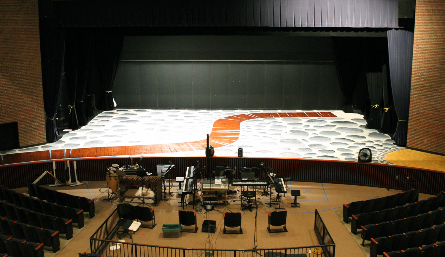 PHS stage with cobblestones and a path painted on it