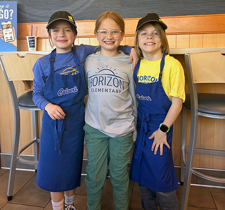 3 students in Culver's aprons