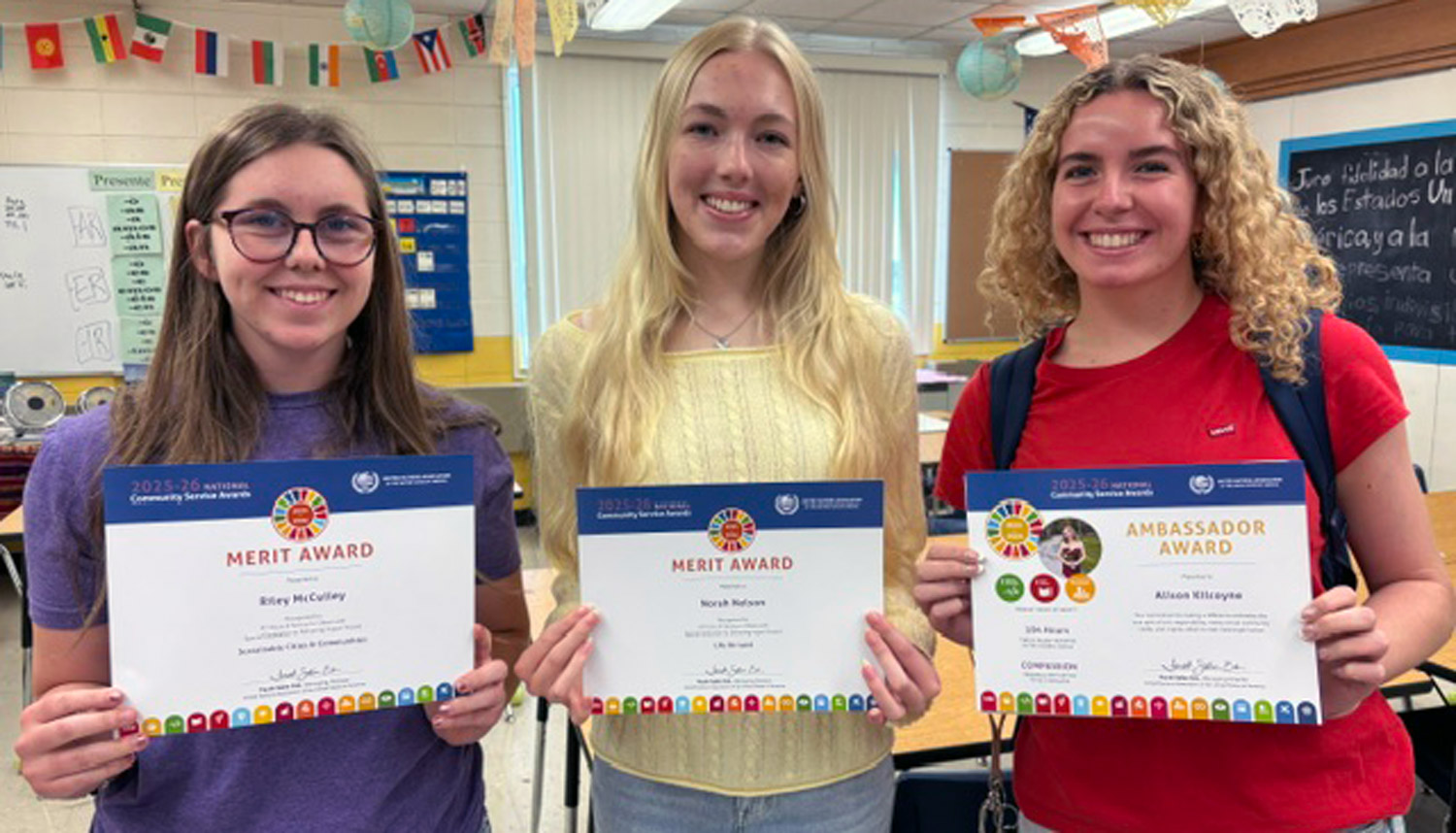 three students holding service certificates