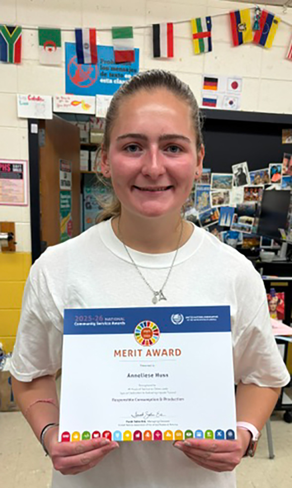 one student holding service certificate