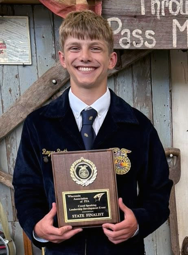 student with speaking plaque