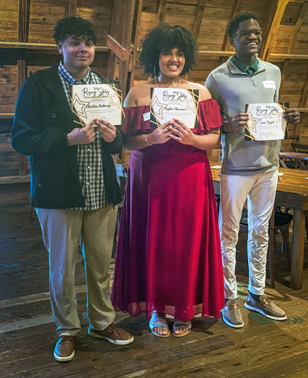 3 students holding certificates