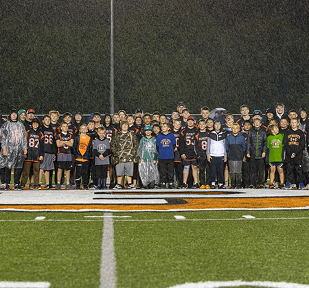 rainy youth football night group photo