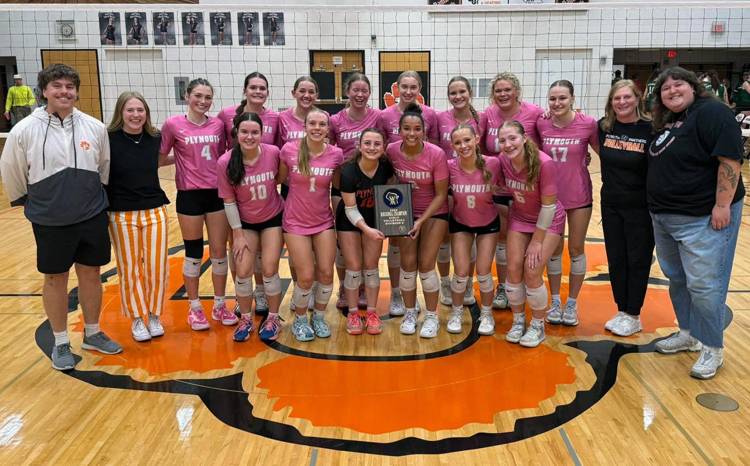 Volleyball team with regional plaque