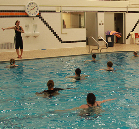 people exercising in pool