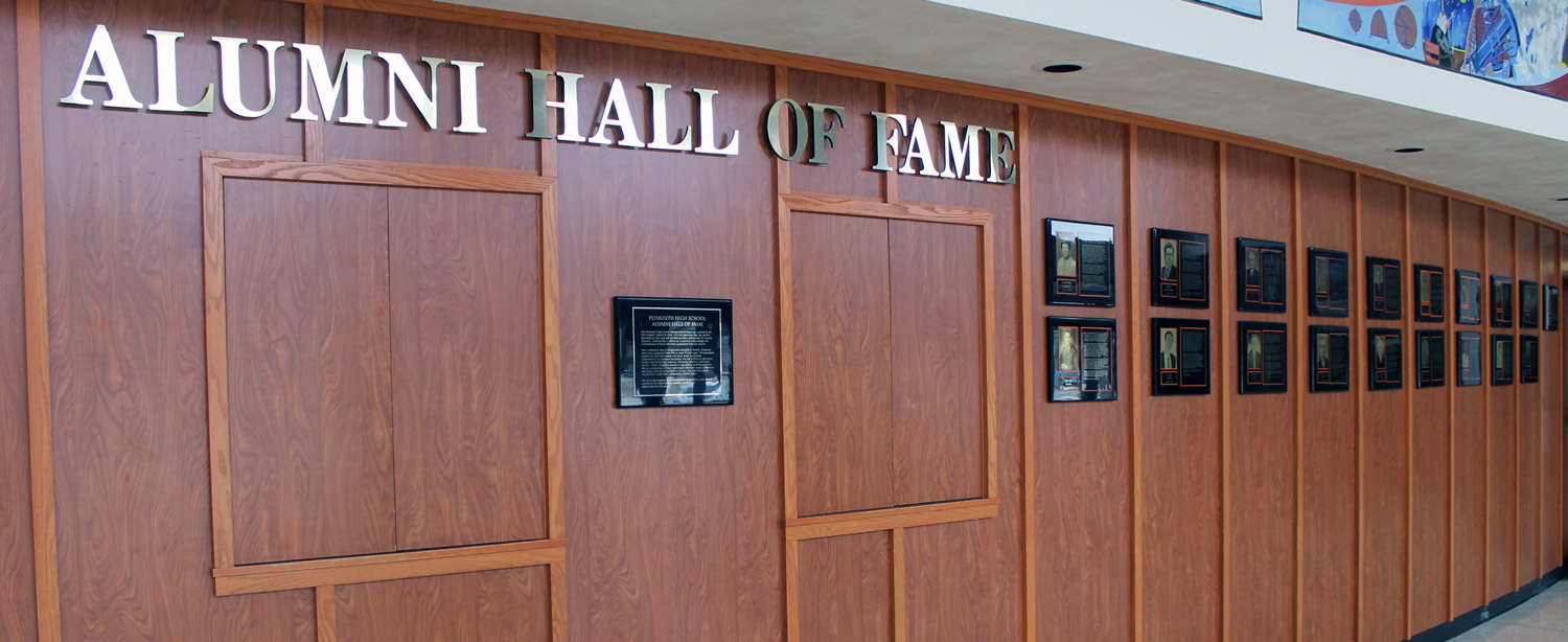 Plaques on curved wood-panel wall