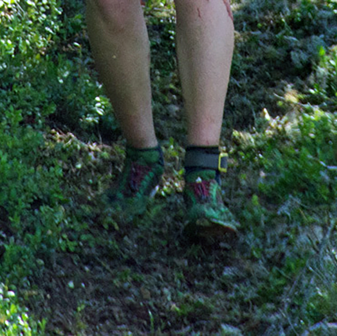 person walking on forest path